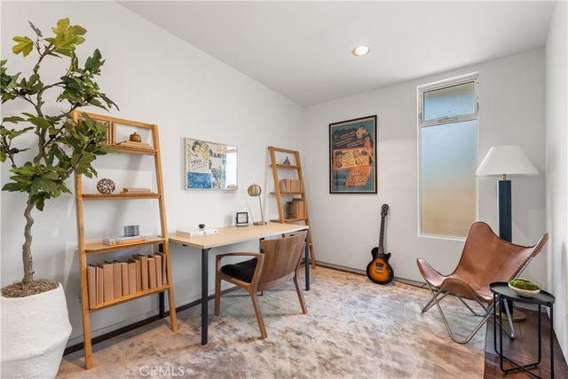 a view of a workspace with furniture and a couch