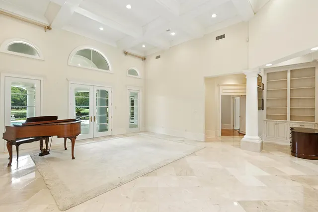 a spacious bathroom with a tub sink and mirror