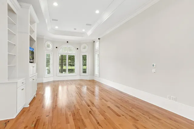 a spacious bathroom with a tub sink and mirror