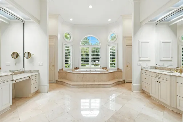 a view of a livingroom with workspace and a window