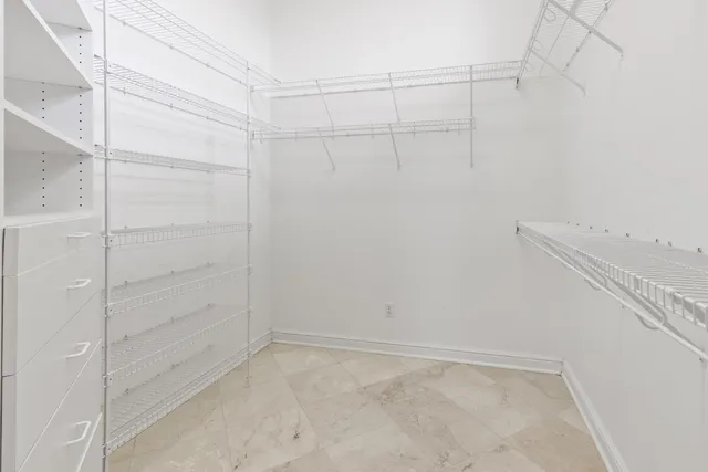 a living room with a bath tub and a chandelier