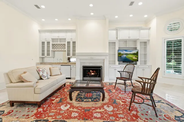a view of empty room with wooden floor and window