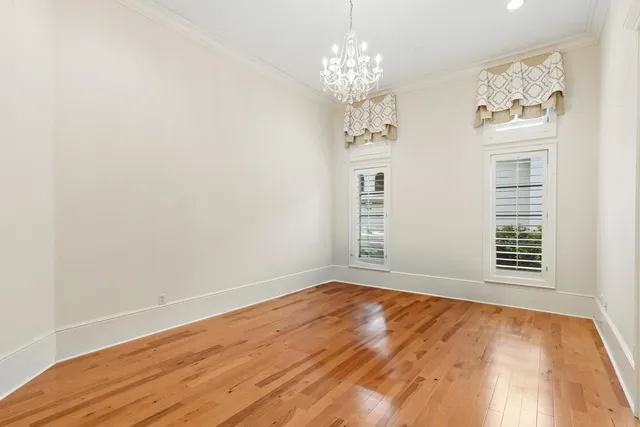 an aerial view of a houses with a yard