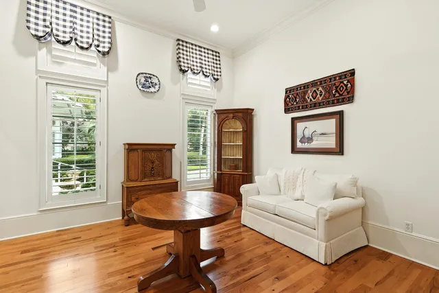 an aerial view of residential houses with outdoor space and trees