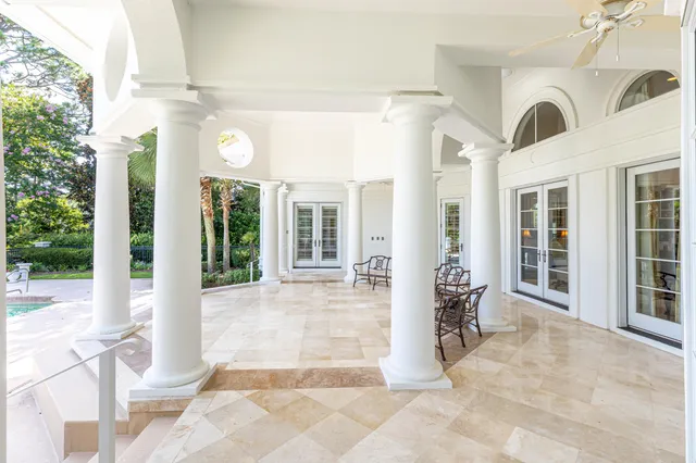 a swimming pool with outdoor seating and yard