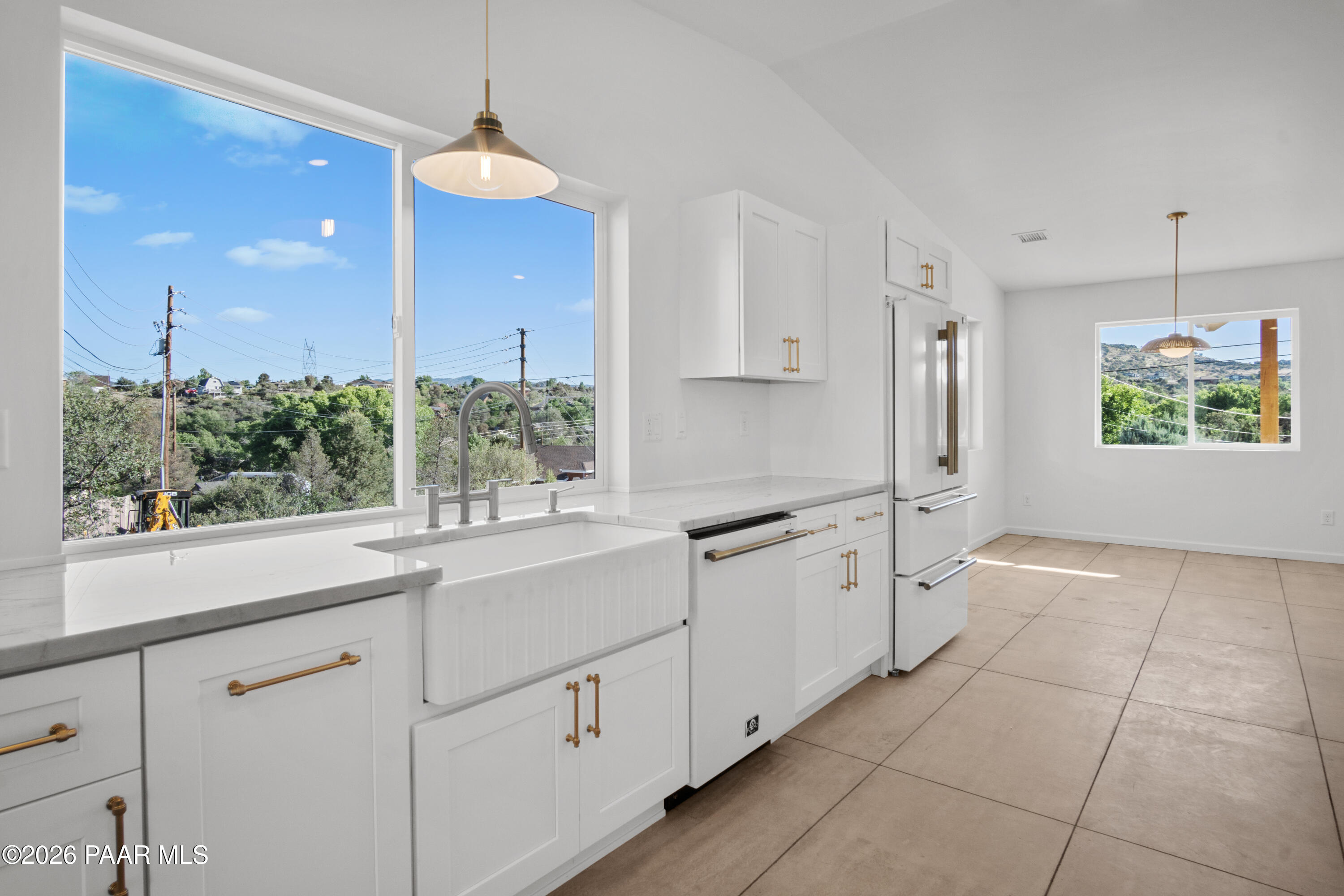 4920 East Amber Road Prescott, AZ 86301 - Photo 8 of 38 a kitchen with white cabinets and window