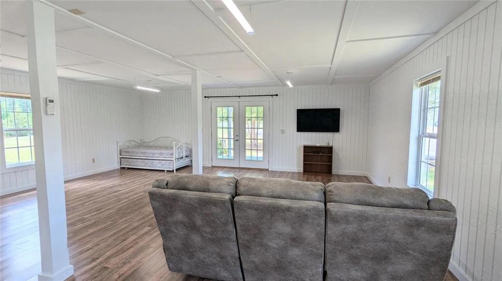 500 Coleman Mill Road Carrollton, GA 30116 - Photo 75 of 83 a living room with furniture a flat screen tv and a fireplace
