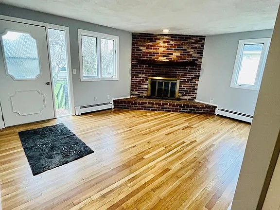 23 Butler Street Newport, RI 02840 - Photo 3 of 18 Brick fireplace in both living rooms