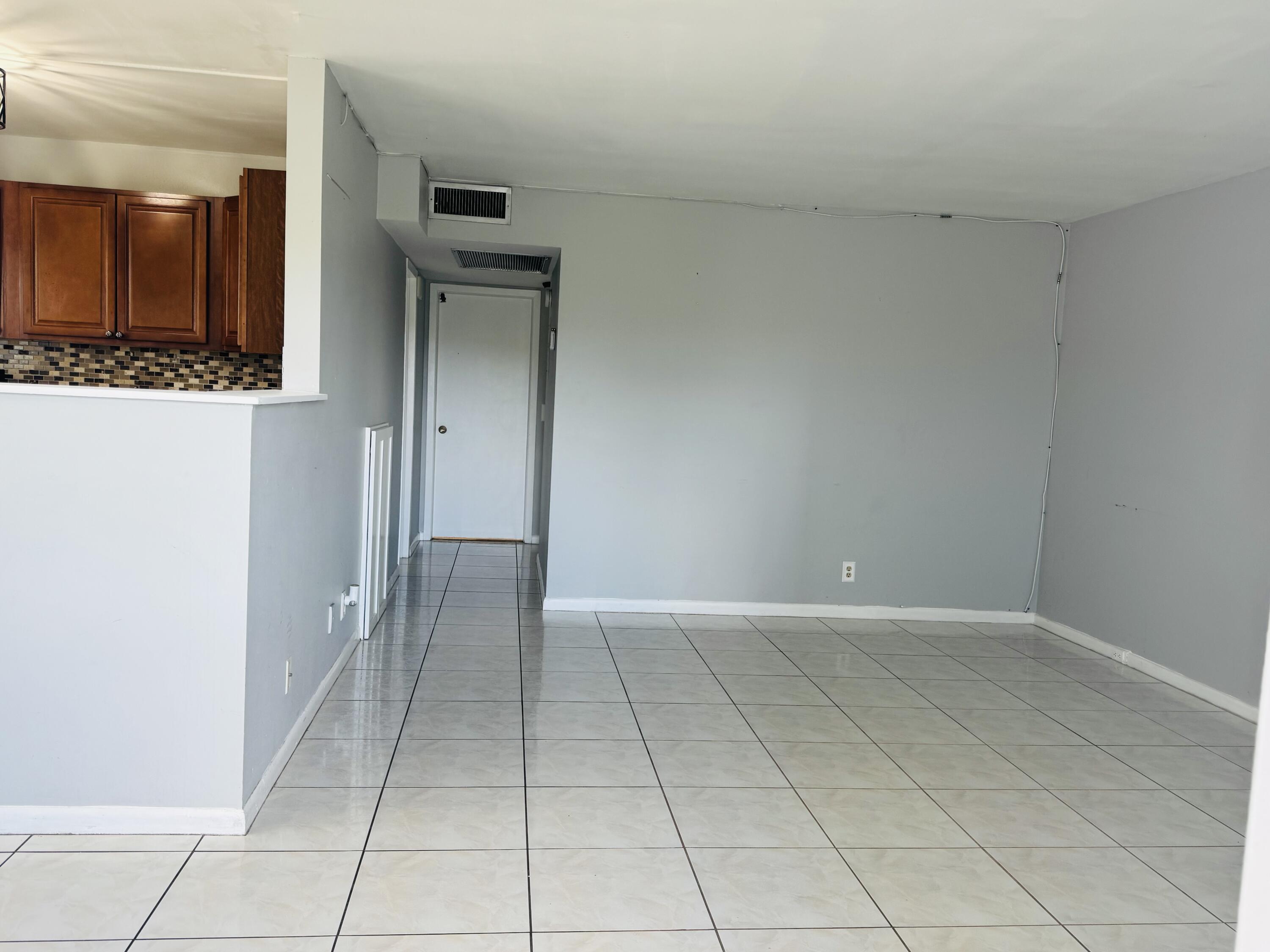 151 Brighton Drive, Unit D Boca Raton, FL 33434 - Photo 9 of 26 LIVING ROOM