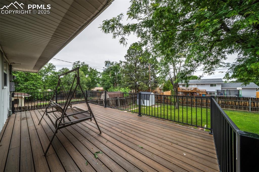 61 Louis Nelson Road Pueblo, CO 81001 - Photo 12 of 50 a view of a wooden deck with a patio
