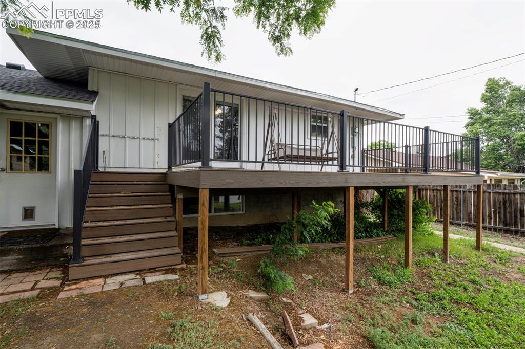 61 Louis Nelson Road Pueblo, CO 81001 - Photo 14 of 50 a view of a house with large windows and a small yard