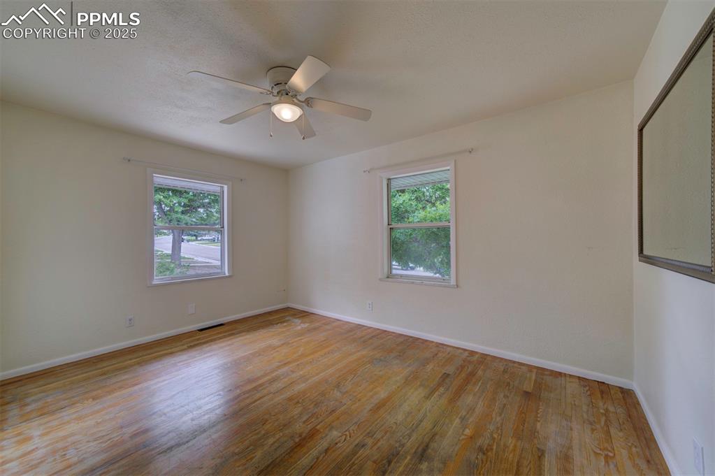 61 Louis Nelson Road Pueblo, CO 81001 - Photo 19 of 50 a view of an empty room with wooden floor and a window