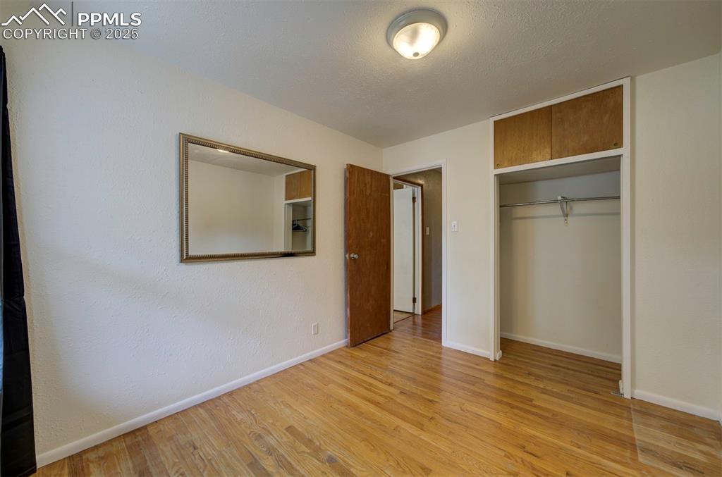 61 Louis Nelson Road Pueblo, CO 81001 - Photo 27 of 50 a view of an empty room with wooden floor and a window