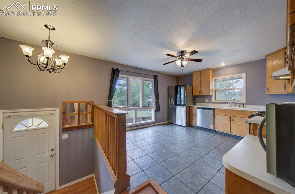 61 Louis Nelson Road Pueblo, CO 81001 - Photo 3 of 50 a view of living room kitchen and windows