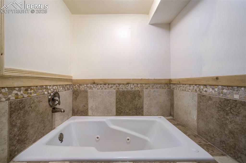 61 Louis Nelson Road Pueblo, CO 81001 - Photo 39 of 50 a white bath tub sitting in a bathroom