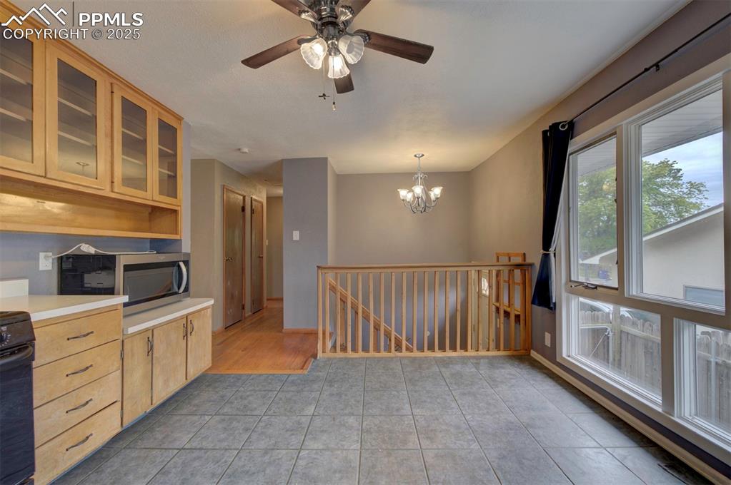 61 Louis Nelson Road Pueblo, CO 81001 - Photo 4 of 50 a view of a kitchen with a sink and dishwasher cabinets