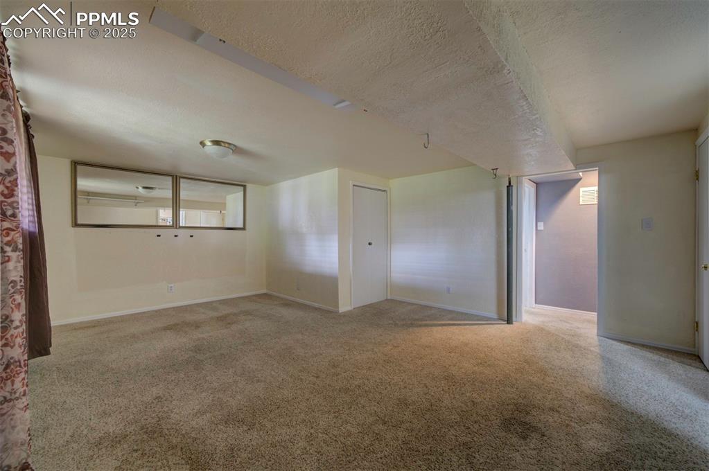 61 Louis Nelson Road Pueblo, CO 81001 - Photo 42 of 50 an empty room with windows and mirror