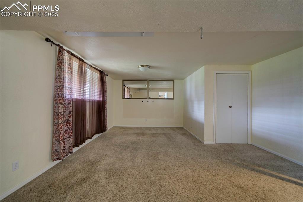 61 Louis Nelson Road Pueblo, CO 81001 - Photo 45 of 50 a view of an empty room with windows