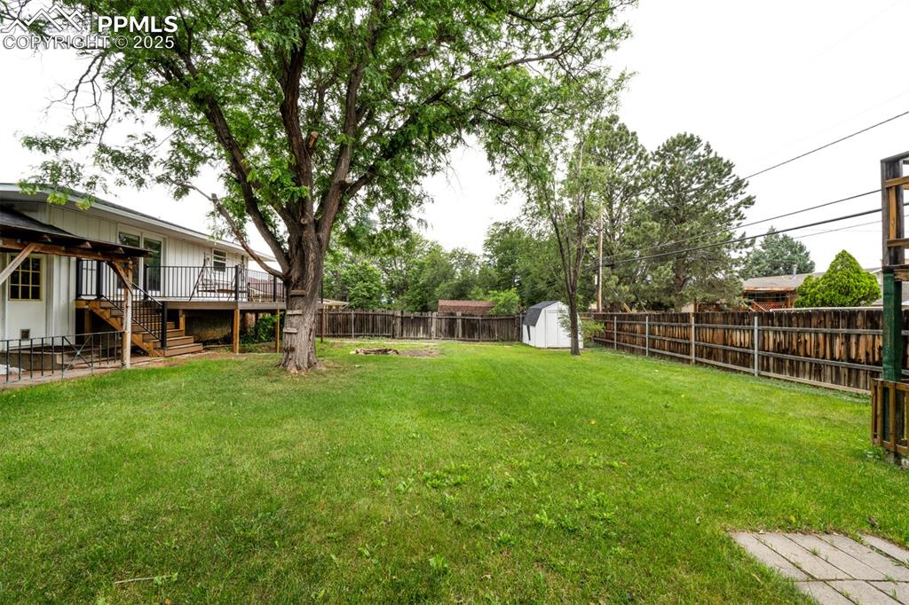 61 Louis Nelson Road Pueblo, CO 81001 - Photo 47 of 50 a front view of a house with a yard and trees