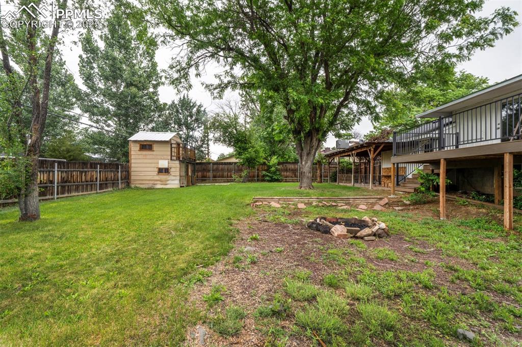 61 Louis Nelson Road Pueblo, CO 81001 - Photo 49 of 50 a view of a house with backyard and a tree