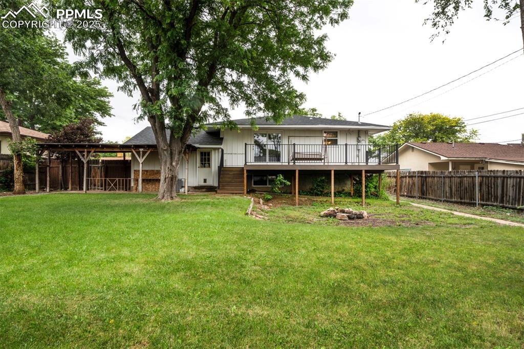 61 Louis Nelson Road Pueblo, CO 81001 - Photo 50 of 50 a view of a house with backyard sitting area and garden