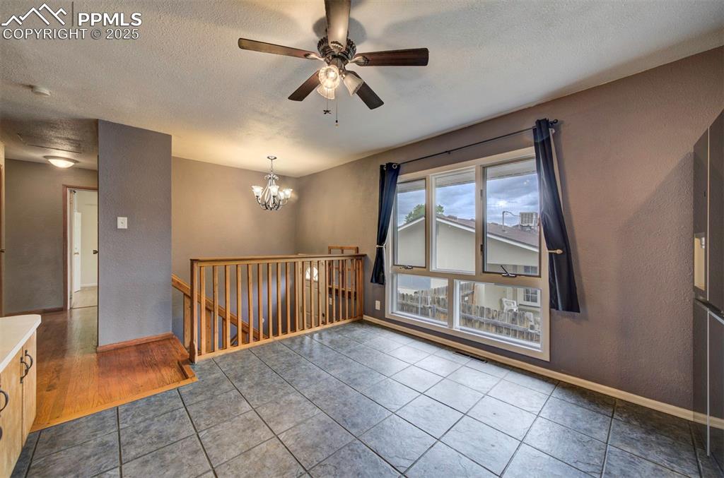 61 Louis Nelson Road Pueblo, CO 81001 - Photo 5 of 50 wooden floor in an empty room with a window