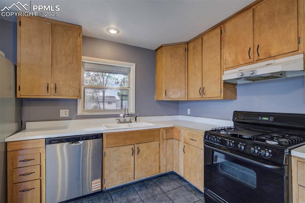 61 Louis Nelson Road Pueblo, CO 81001 - Photo 8 of 50 a kitchen with a sink stove and cabinets