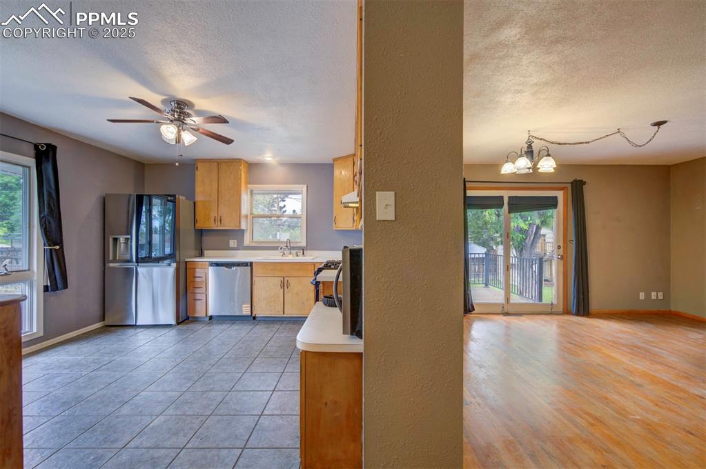 61 Louis Nelson Road Pueblo, CO 81001 - Photo 10 of 50 a view of a kitchen with refrigerator and cabinets