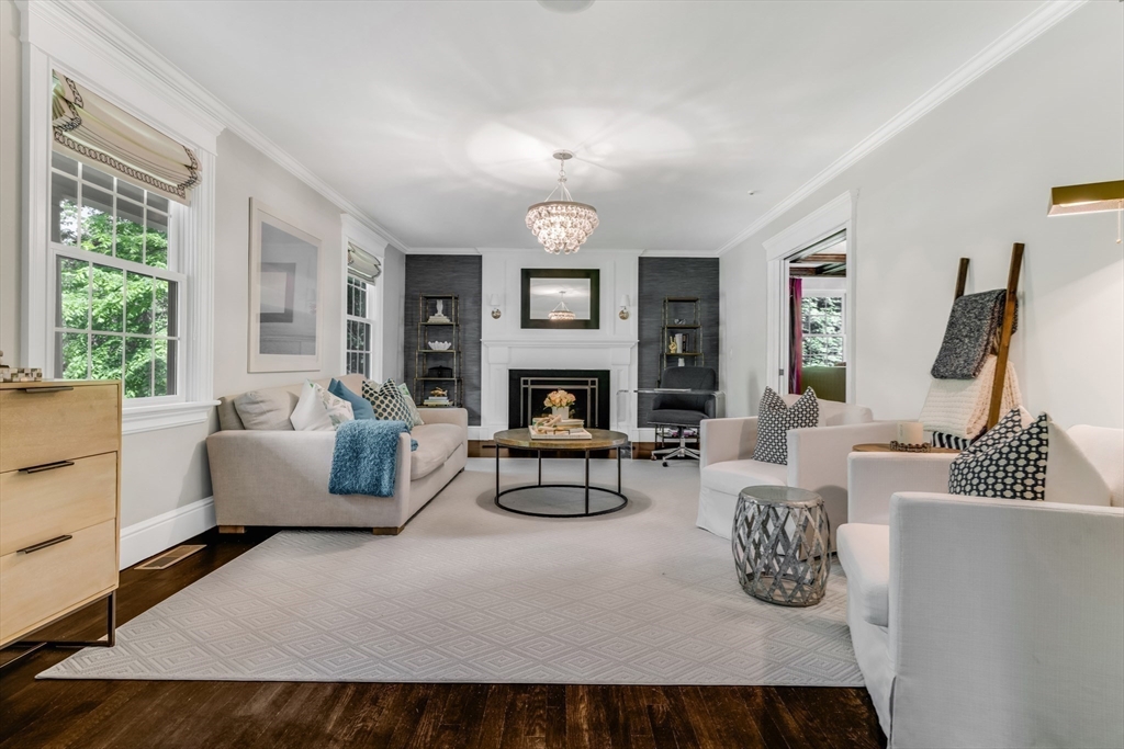 85 Old Farm Road Milton, MA 02186 - Photo 10 of 42 a living room with furniture a fireplace and a large window