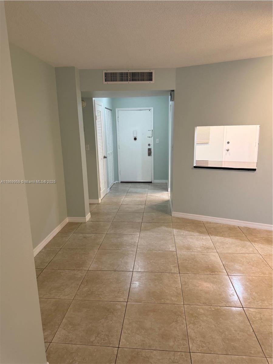 1710 Northeast 191st Street, Unit 2083 Miami, FL 33179 - Photo 11 of 36 a view of an empty room