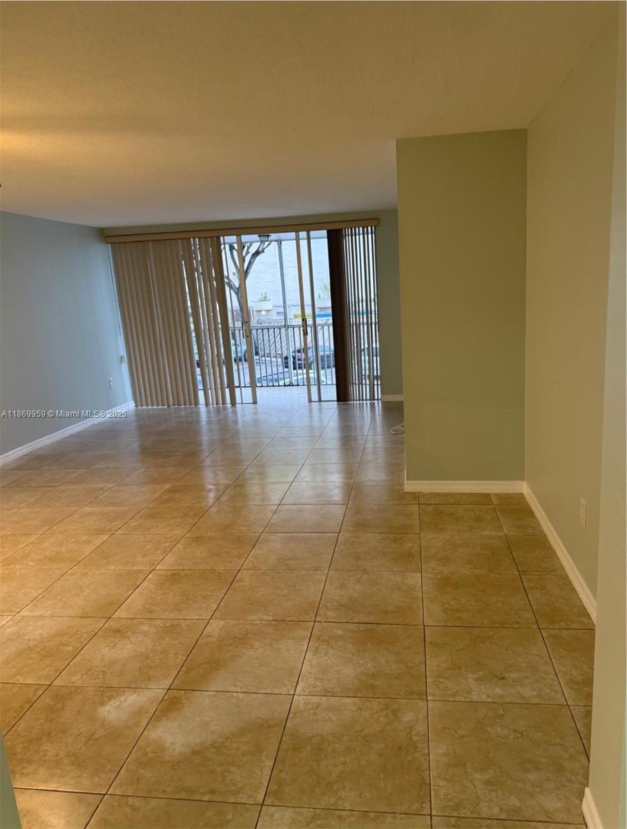 1710 Northeast 191st Street, Unit 2083 Miami, FL 33179 - Photo 25 of 36 a view of an empty room and window