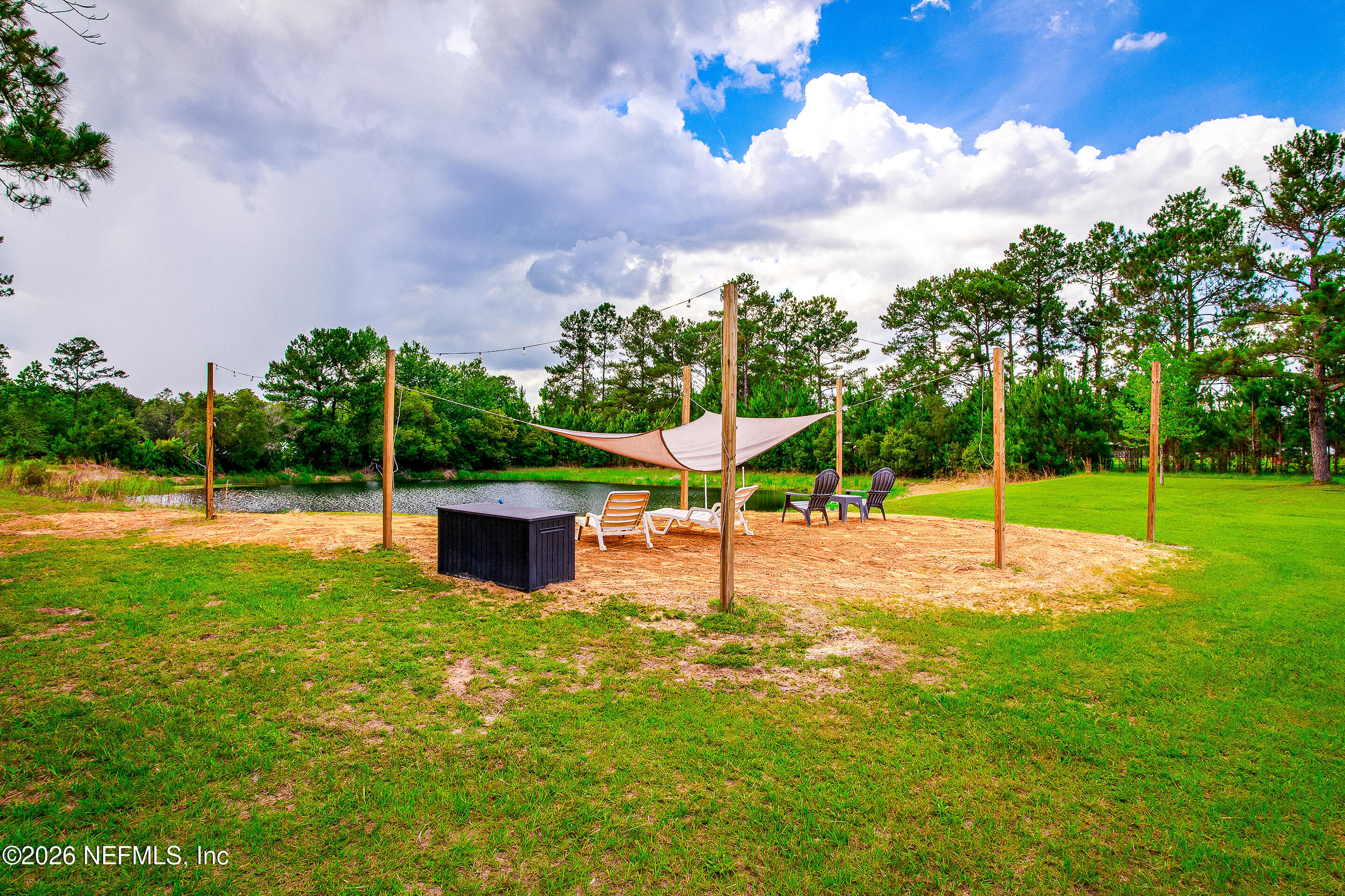 26575 Sheared Stokes Road Hilliard, FL 32046 - Photo 25 of 39 a view of a playground with a garden