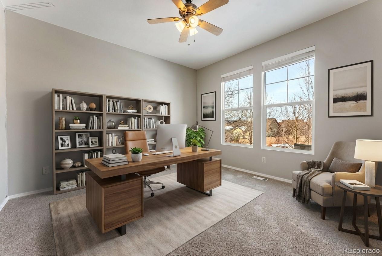 10744 Rhinestone Drive Colorado Springs, CO 80908 - Photo 15 of 24 a view of a workspace with furniture and a window