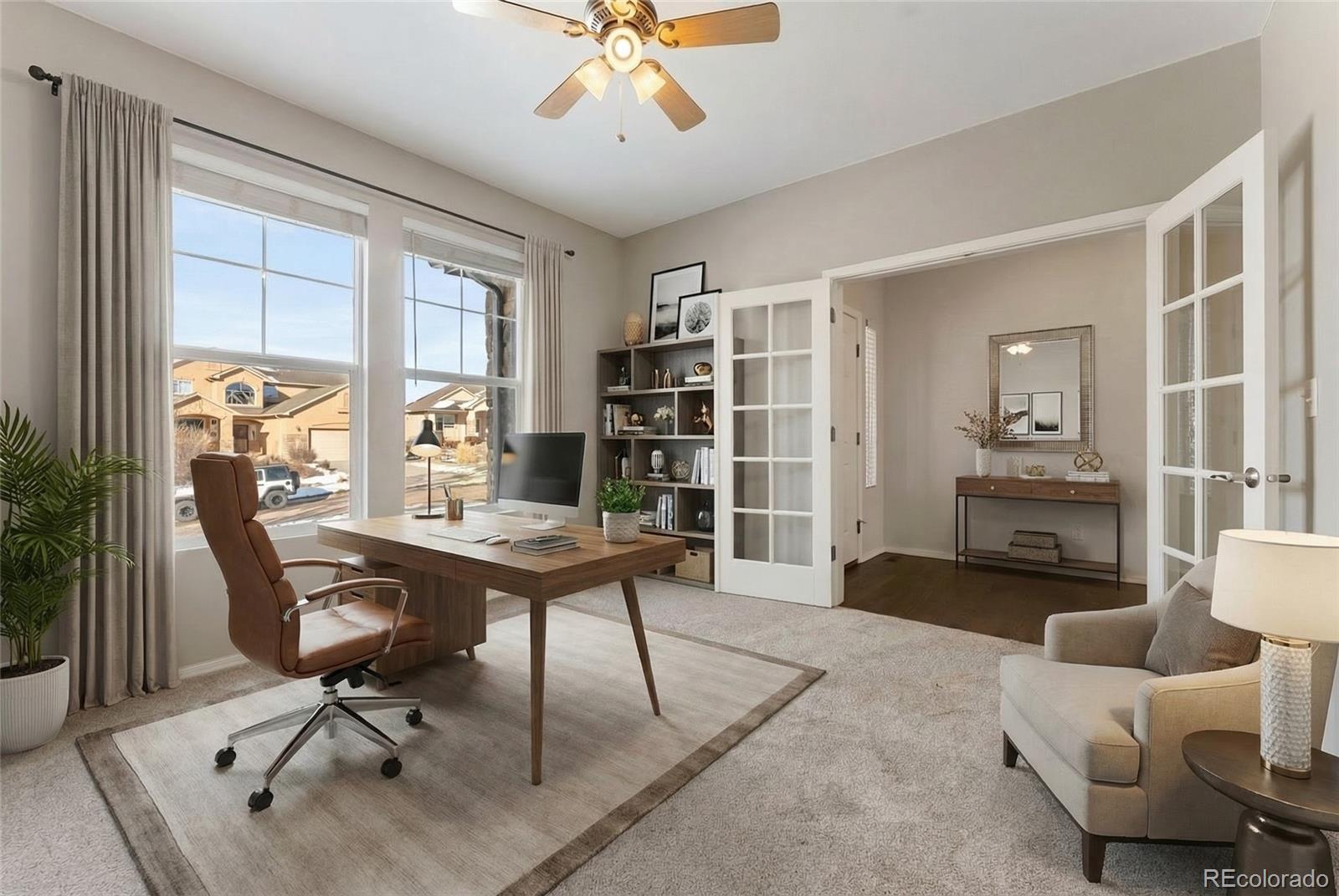 10744 Rhinestone Drive Colorado Springs, CO 80908 - Photo 16 of 24 a view of a workspace with furniture and a window