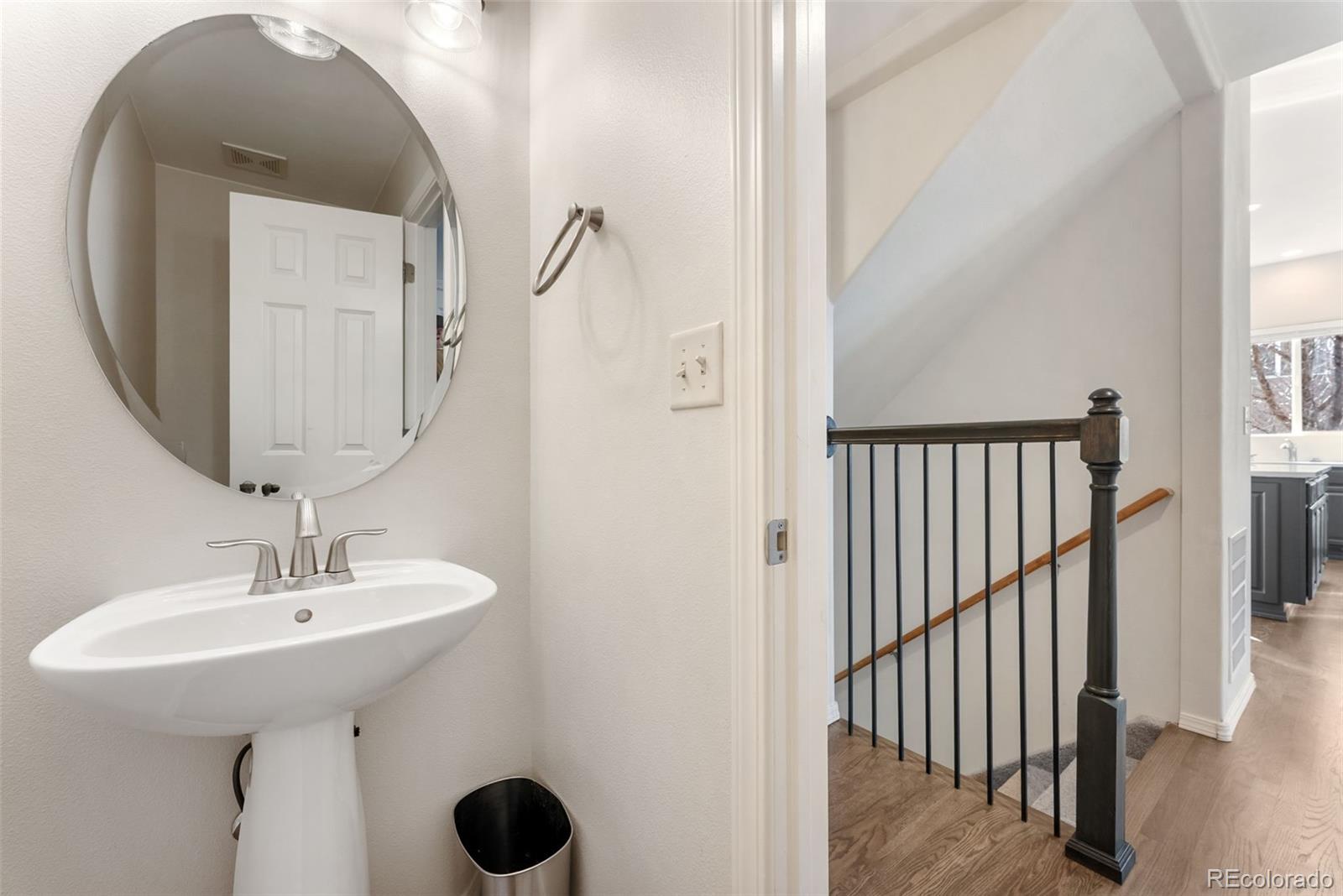 10744 Rhinestone Drive Colorado Springs, CO 80908 - Photo 17 of 24 a bathroom with a sink and mirror