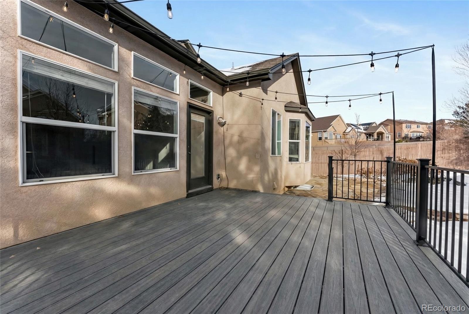 10744 Rhinestone Drive Colorado Springs, CO 80908 - Photo 20 of 24 a view of a house with a balcony