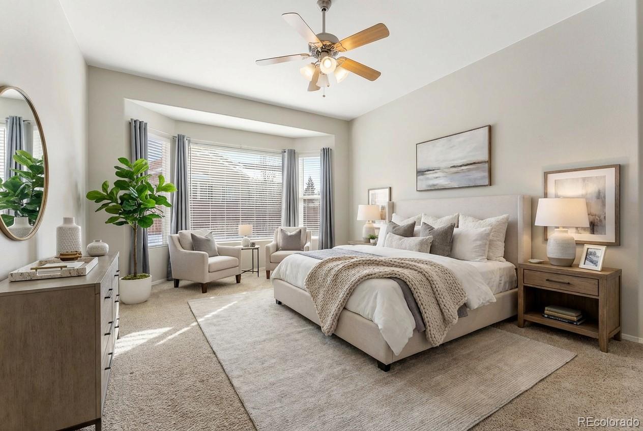 10744 Rhinestone Drive Colorado Springs, CO 80908 - Photo 5 of 24 a spacious bedroom with a bed and a chandelier