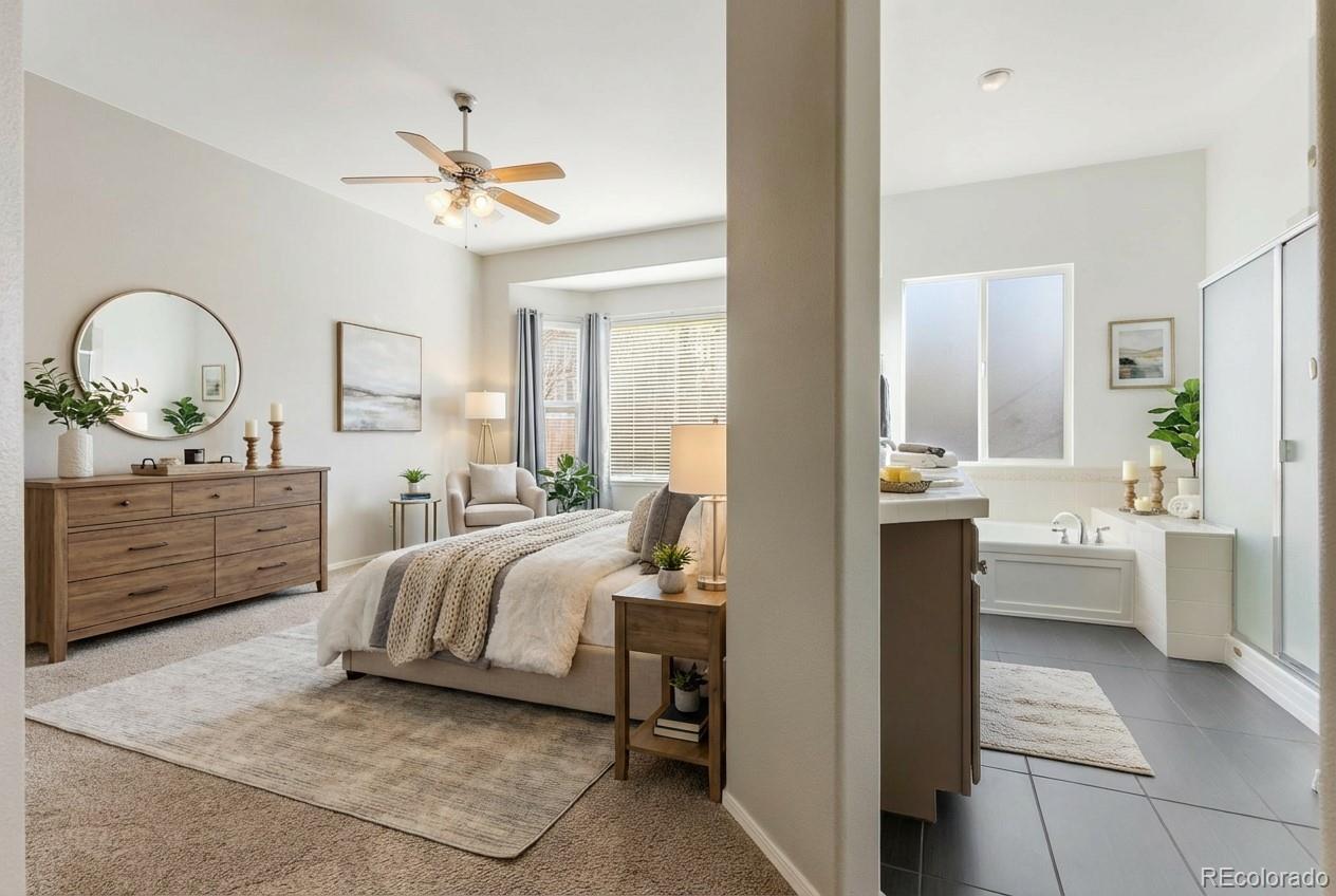 10744 Rhinestone Drive Colorado Springs, CO 80908 - Photo 6 of 24 a bedroom with a bed and a chandelier