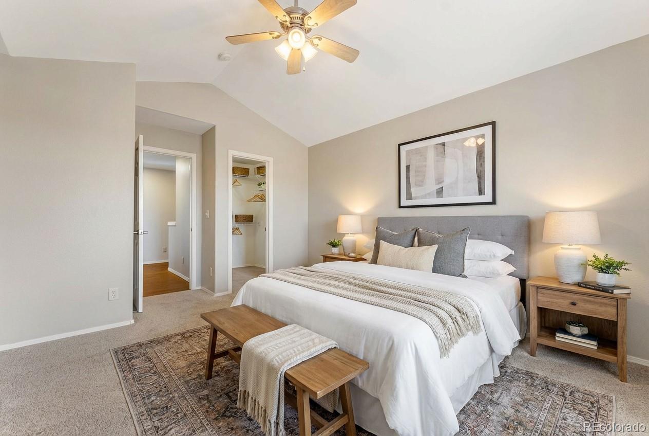 10744 Rhinestone Drive Colorado Springs, CO 80908 - Photo 8 of 24 a bedroom with a bed and a chandelier