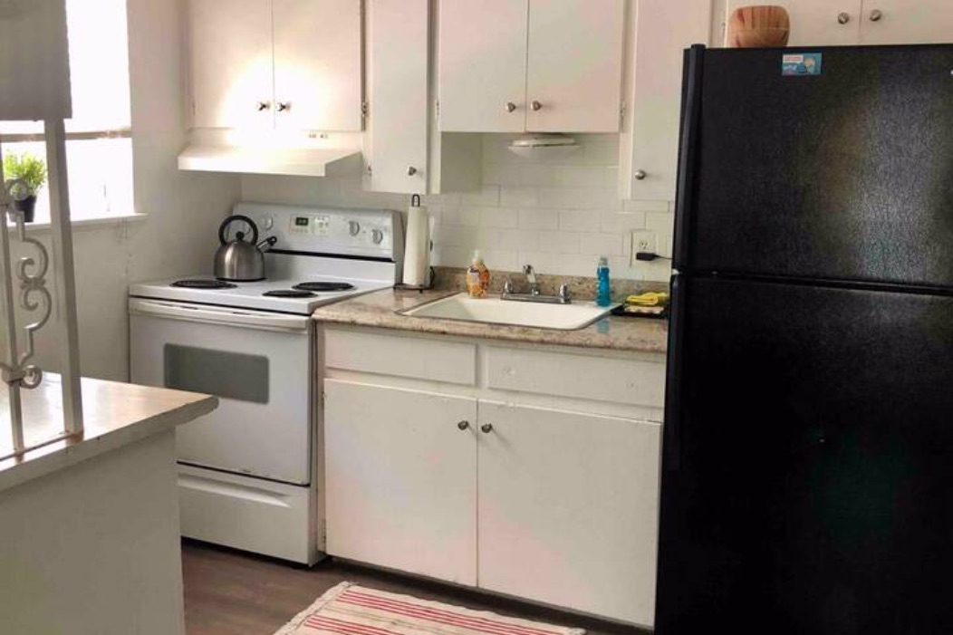 5909 Bolm Road, Unit 2 Austin, TX 78721 - Photo 7 of 10 a kitchen with a sink and a refrigerator