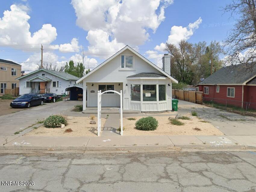 1832 H Street Sparks, NV 89431 - Photo 1 of 15 a view of a white house with a yard