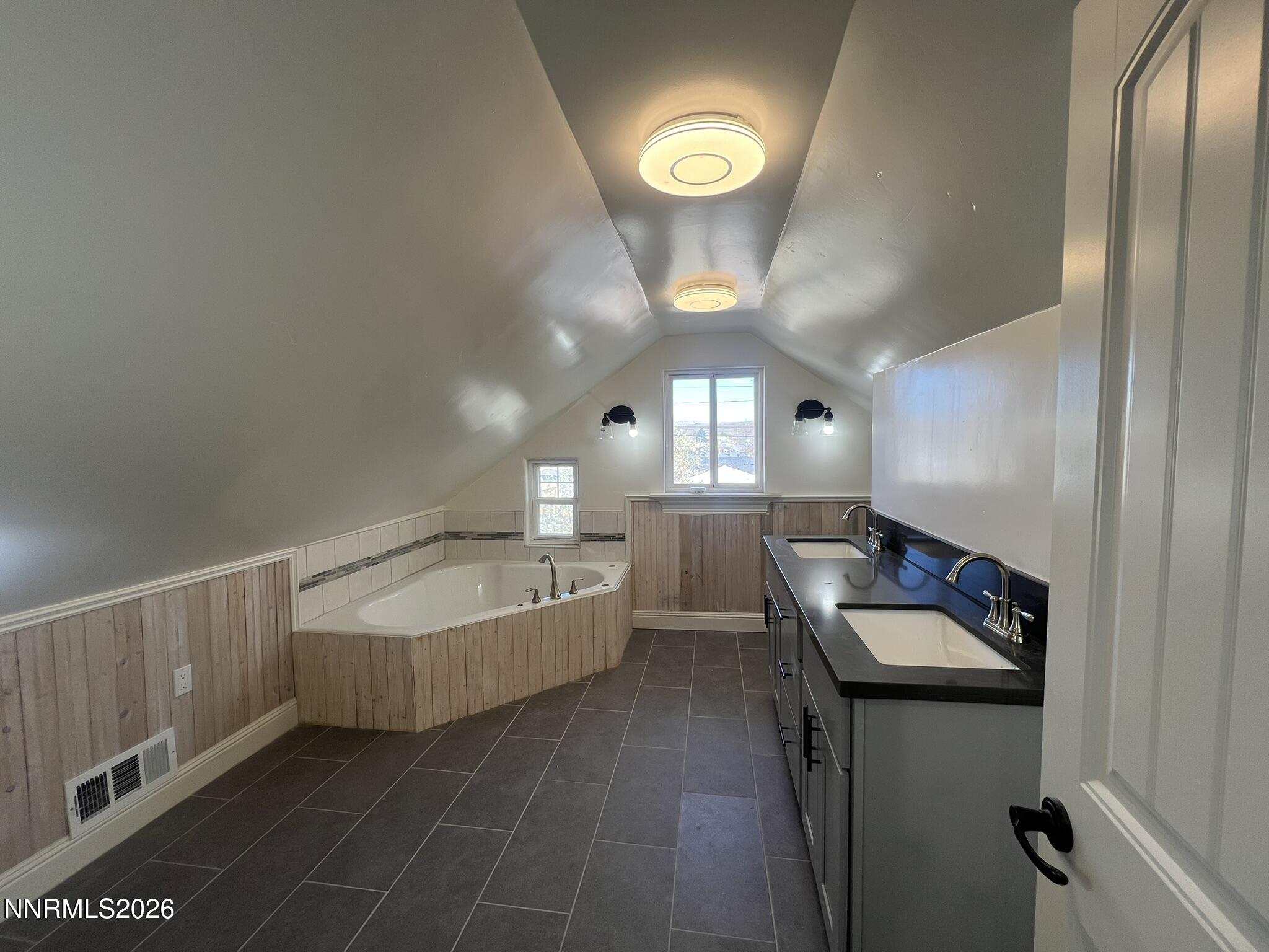 1832 H Street Sparks, NV 89431 - Photo 14 of 15 a bathroom with a sink and a mirror