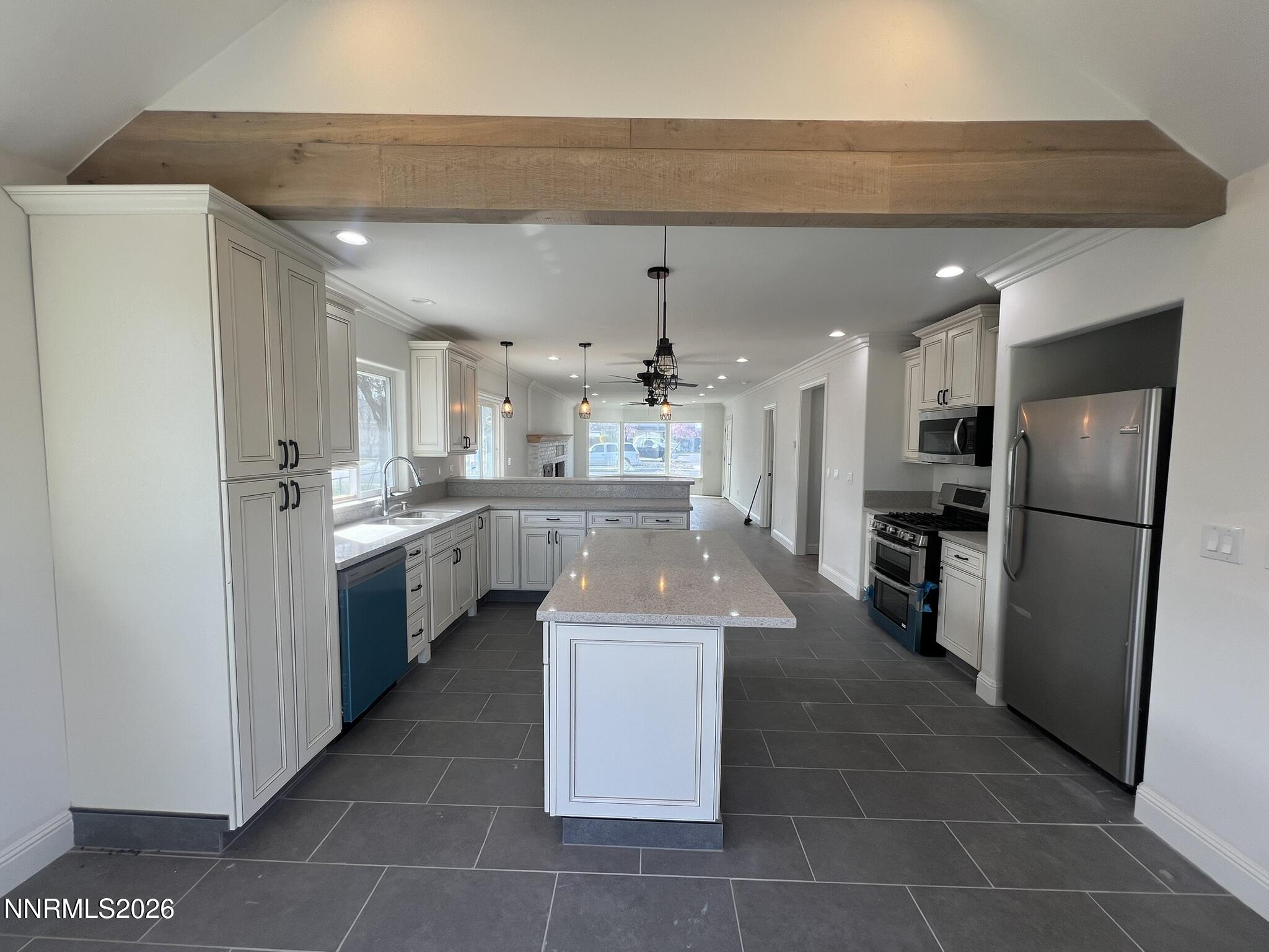1832 H Street Sparks, NV 89431 - Photo 6 of 15 a large kitchen with a large counter top stainless steel appliances and cabinets