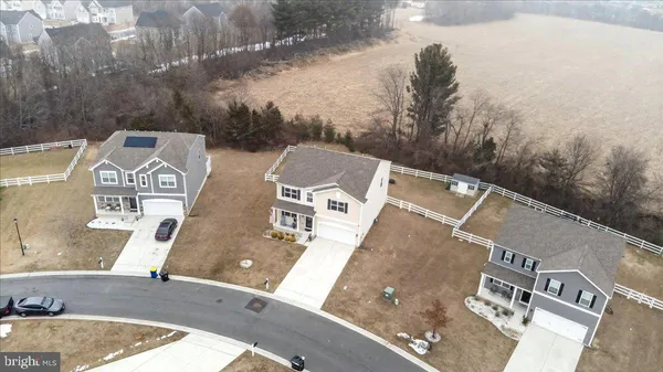 aerial view of a house with a yard