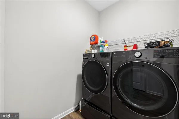 a view of a livingroom with a large window and couch
