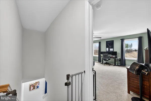 a bedroom with furniture and a flat screen tv