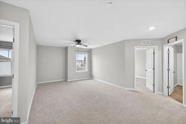 a bedroom with furniture and a chandelier