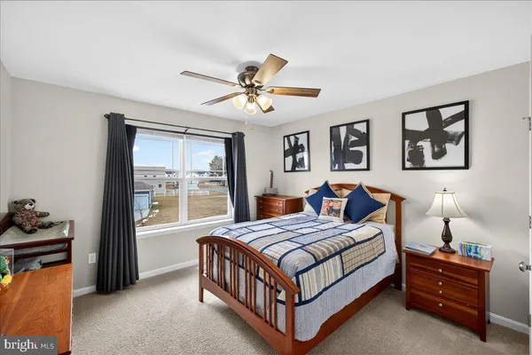 a bathroom with a sink mirror and toilet