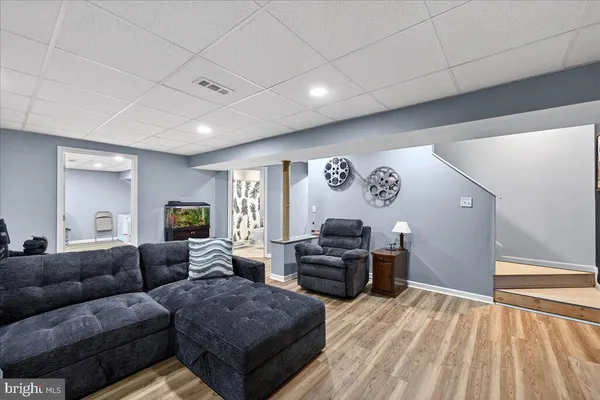 a room with furniture and gym equipment