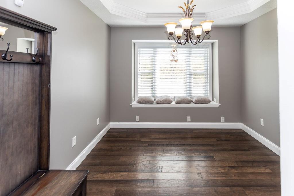 159 Reservoir Hill Road Uniontown, PA 15401 - Photo 12 of 50 a view of an empty room with wooden floor and a window